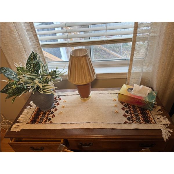 Table runner, artificial plant and lamp