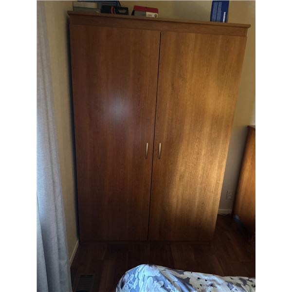 Wardrobe cabinet measures 48" x 21" x 72 1/4" tall
