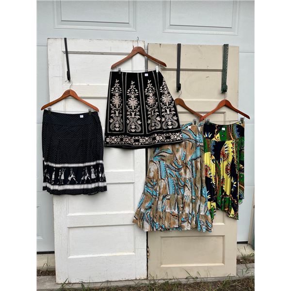 4 skirts sizes XL - like new- 33"L