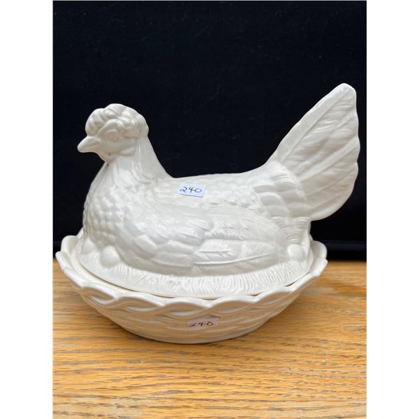 Vintage white hen on a nest