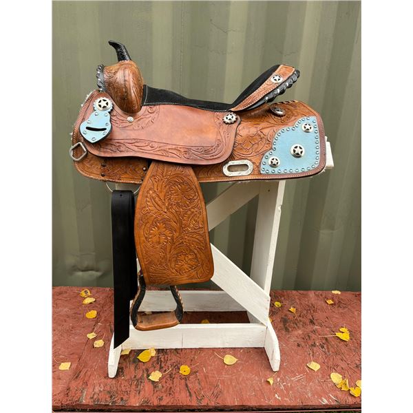 Barrel racing saddle- embossed leather with turquoise blue accents and silver Lonestar medallions