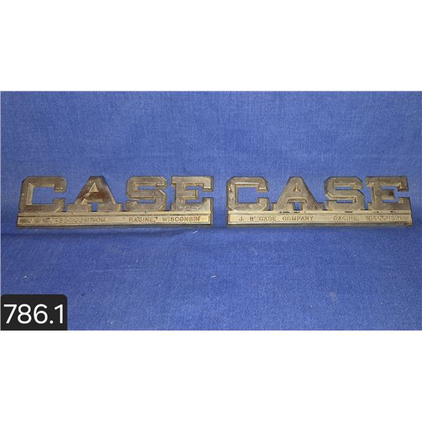 Pair of J. I. Case tractor emblems, 1960s, with tabs on back