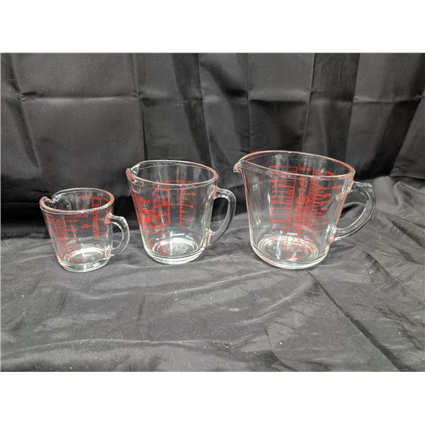 (3) Set of Glass Measuring Cups (2) Pyrex (1) Fire King