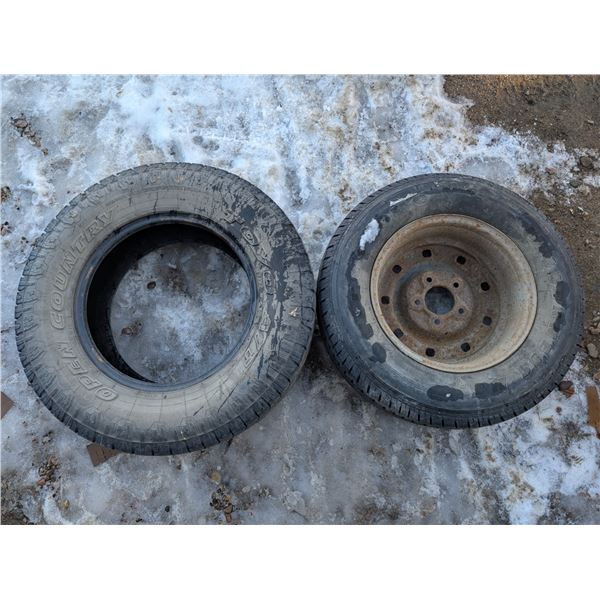 (2) Tires (1) 125/70R18 and (1) W/ Rim P235/70R16