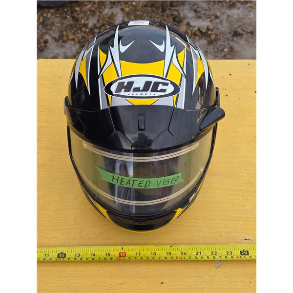 Snowmobile helmet with heated visor