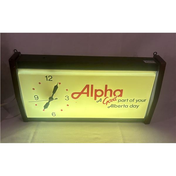 Alpha advertising clock - 20"x10-1/2", small crack by #9 on plastic, working