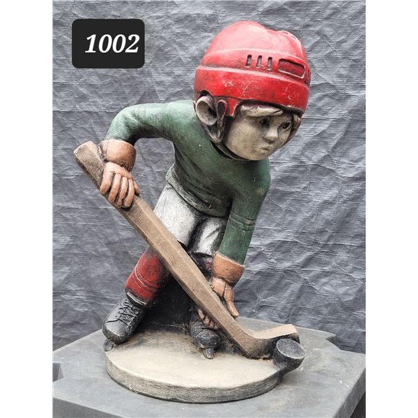 Cement hockey player yard ornament. 19” High