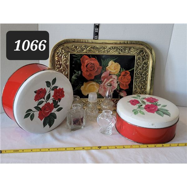 Mid Century rose tins & tray with assorted bottles.