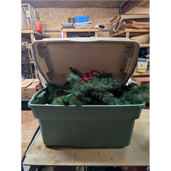 Storage Tub Full of Fake Pine Branches and Tree Base Holder