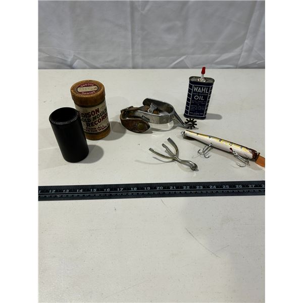 Vintage fishing lure, vintage spurs, vintage phonograph cylinder record and vintage Wahl clipper oil