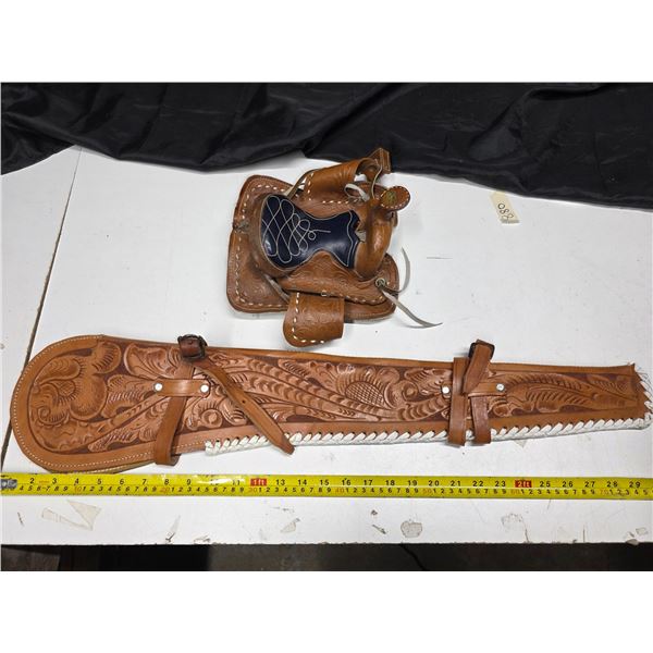 Leather gun holster and mini leather horse saddle