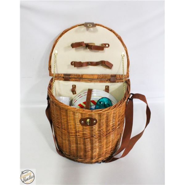 WICKER PICNIC BASKET WITH ITEMS IN IT