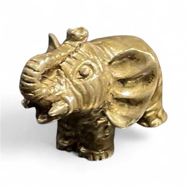 Solid Sterling Silver Elephant Miniature - 1" x 1" x 1.5" - Weight: 20 grams. Can be hung by the tru