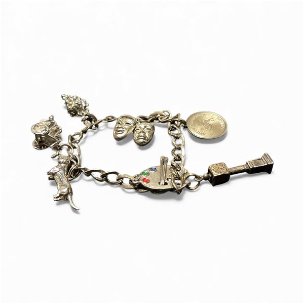 Sterling Silver Charm Bracelet with 7 Sterling Charms - Weight: 30.5 grams
