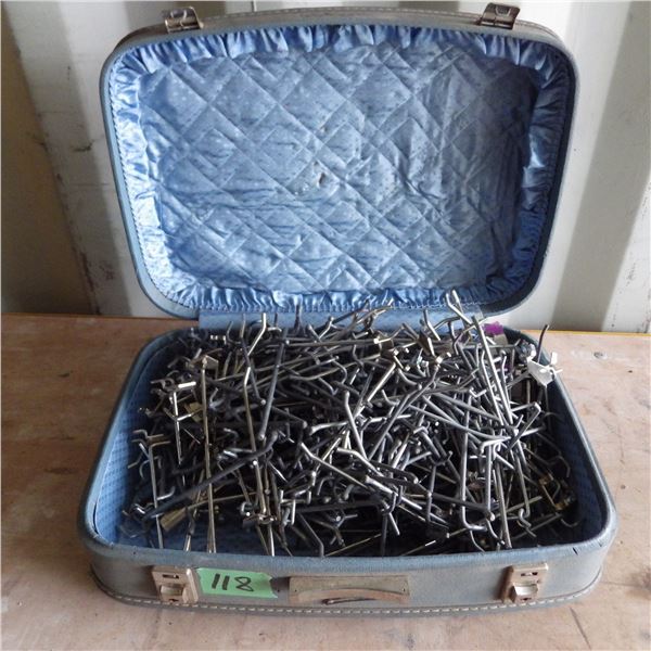 Suitcase with pegboard hooks