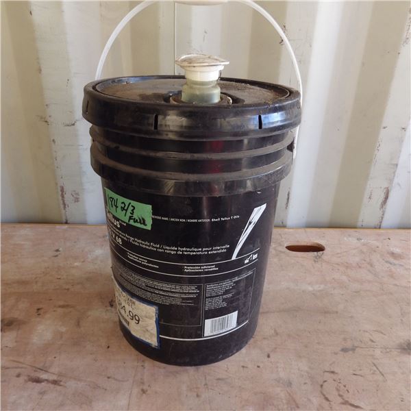 Pail approximately two thirds full hydraulic fluid