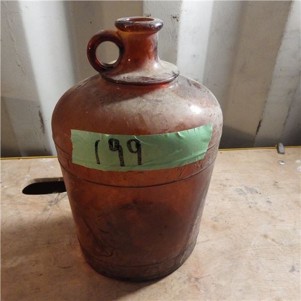 Brown glass jug with handle possibly Javex bottle