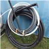 Image 1 : assorted rolls of plastic water hose