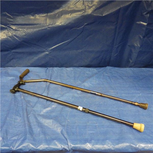 two adjustable walking canes