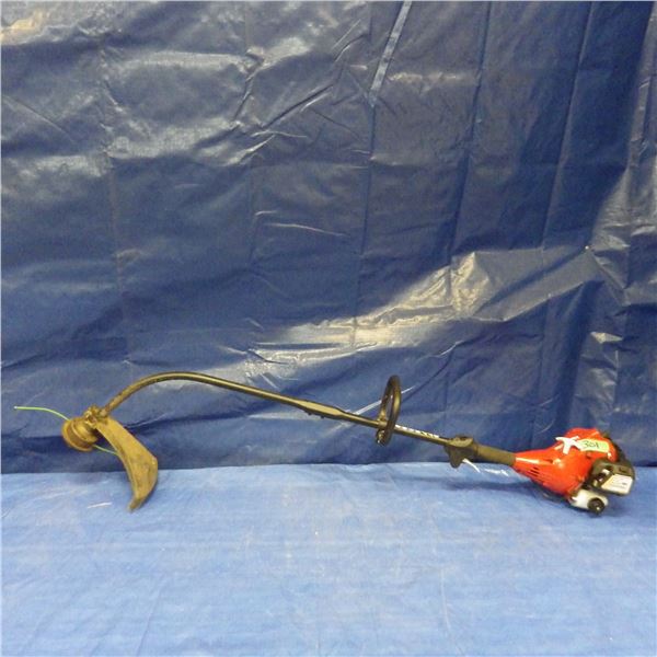 Homelite gas string trimmer with spool of line