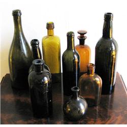 Nine Antique Brown Glass Bottles