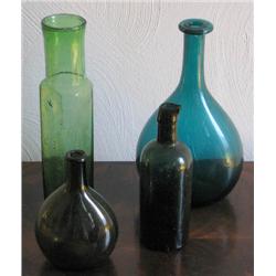 Four Antique Green Glass Bottles