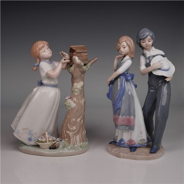 A Pair of  Glazed Ceramic Figurines, one by Nadal, depicting children