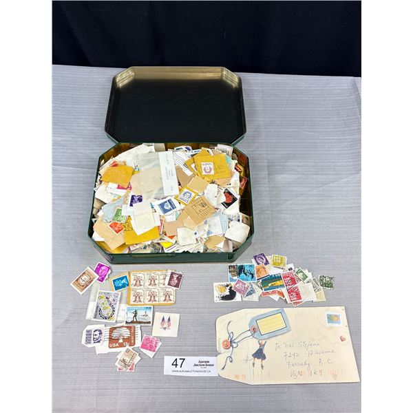 An Old Tin Filled w/ Old Stamps