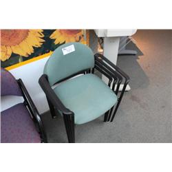 4 green stacking chairs