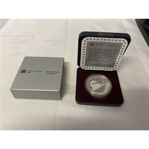 1986 CANADIAN SILVER DOLLAR VANCOUVER 'TRAIN' .500 SILVER