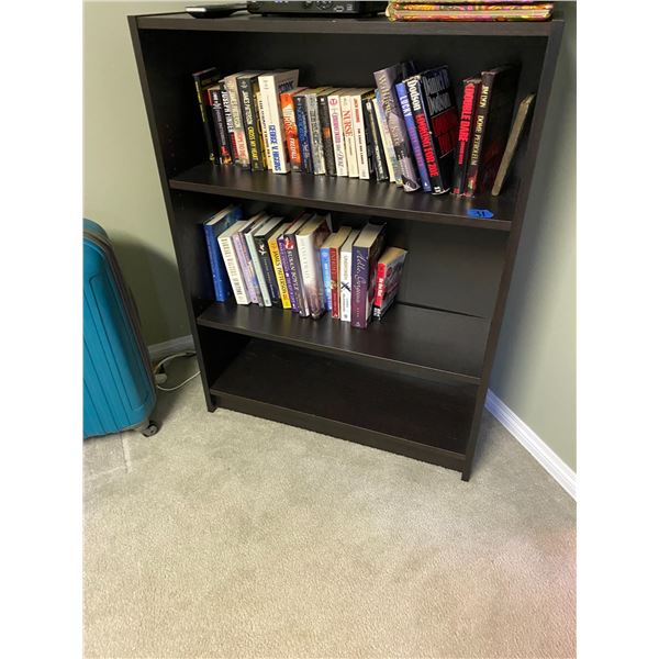 Bookshelf with paperback and hardcover books