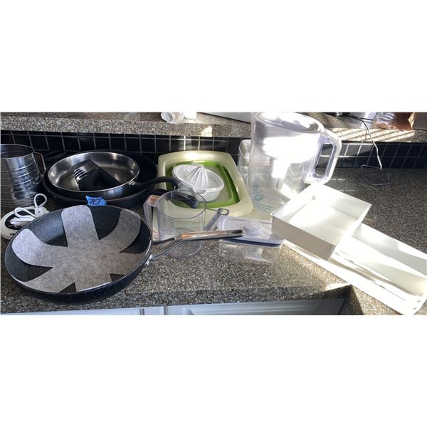 Assorted kitchen items including fry pans