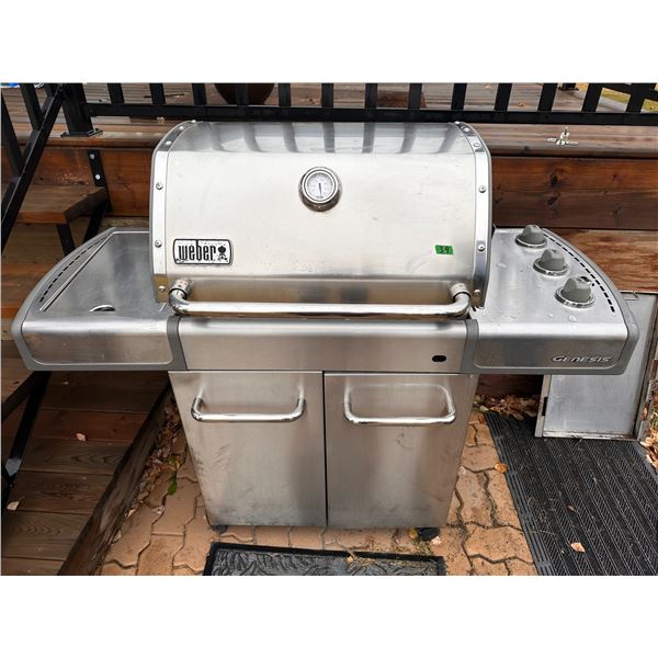 Weber brand gas BBQ with propane tank and cover