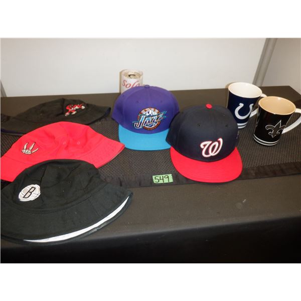 Lot of sports hats and coffee mugs
