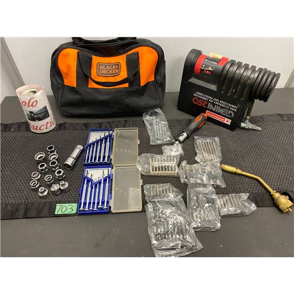 Black & Decker tool bag with assorted driver bits and compact MotoMaster Gemini 250 air compressor