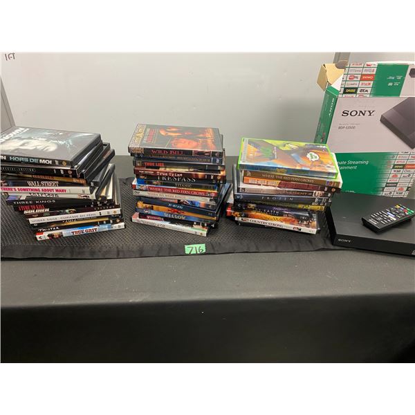 Lot of assorted DVD movies and Sony BOP-S3500 streaming device with remote control