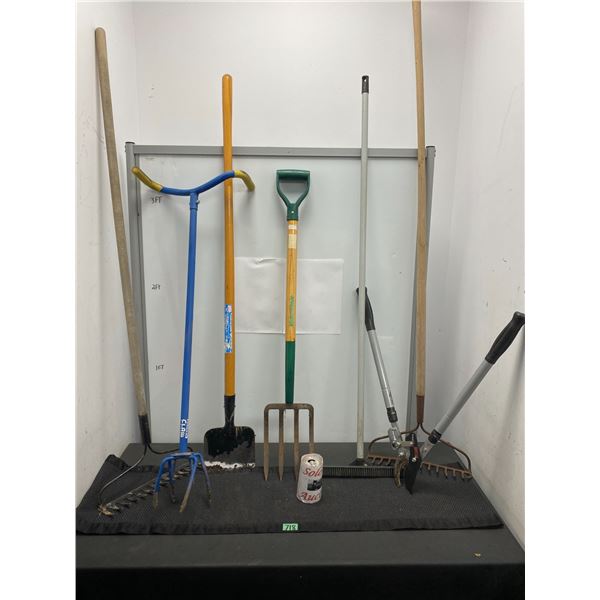 Lot of outdoor garden tools including rakes, loppers and more