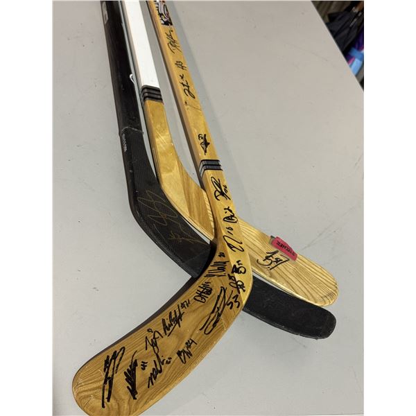 Three Signed Hockey Sticks