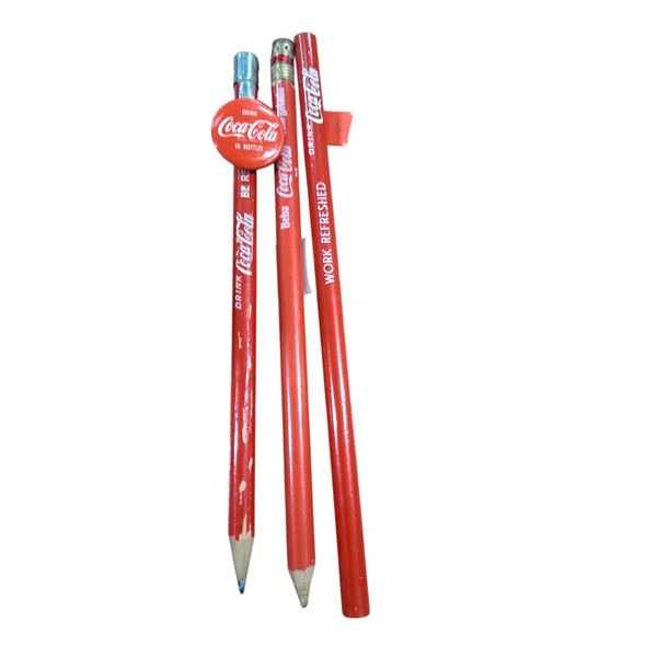 3 1950s Coca-Cola pencils, one has topper