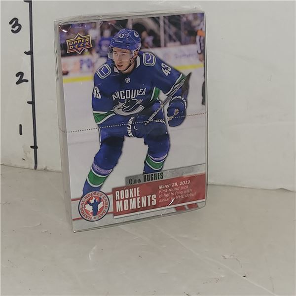 Lot of 25 Factory Sealed Quinn Hughes Rookie Moments Rookie Cards - Ready to be graded!