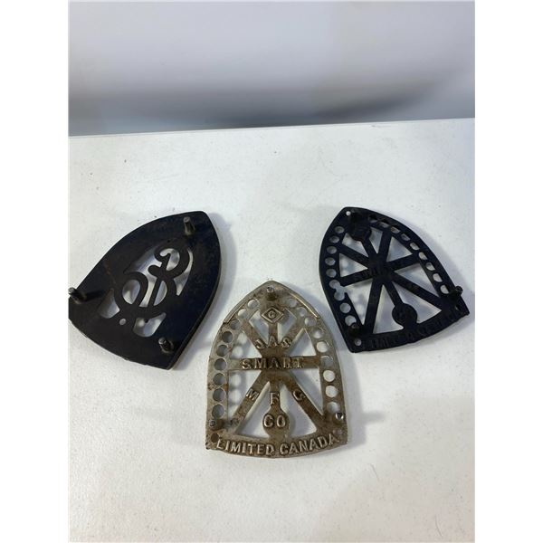Group of Three Cast Iron Trivets
