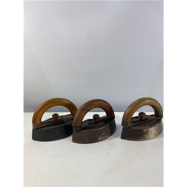 Set of Three Cast Iron Sad Irons with Wooden Handles