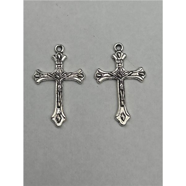 Two Silver Cruciform Metal Charms