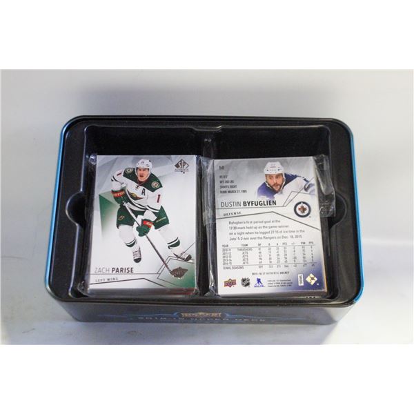 TIN FULL OF OPENED CARDS