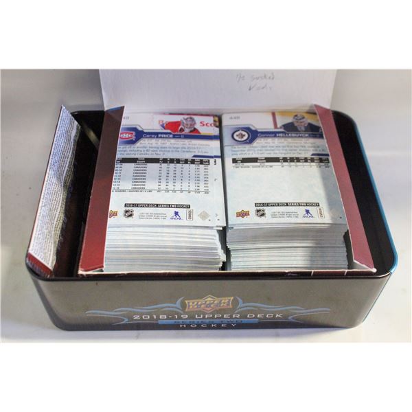 TIN FULL OF OPENED CARDS