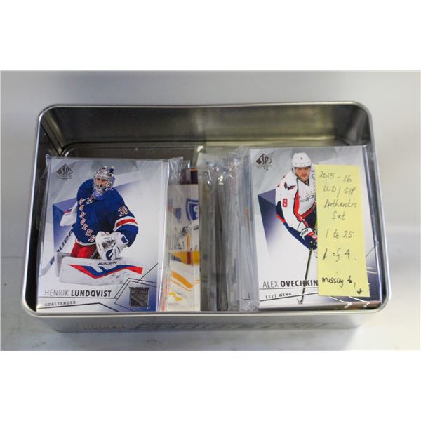 TIN FULL OF OPENED CARDS