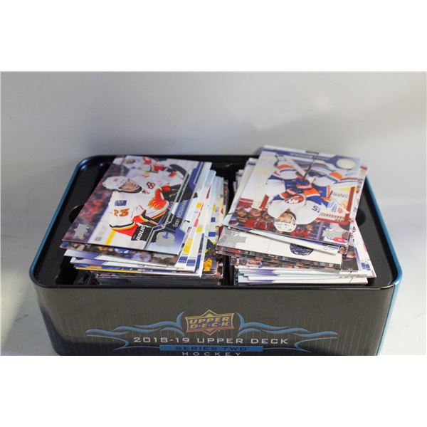 TIN FULL OF OPENED CARDS