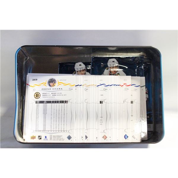 TIN FULL OF OPENED CARDS