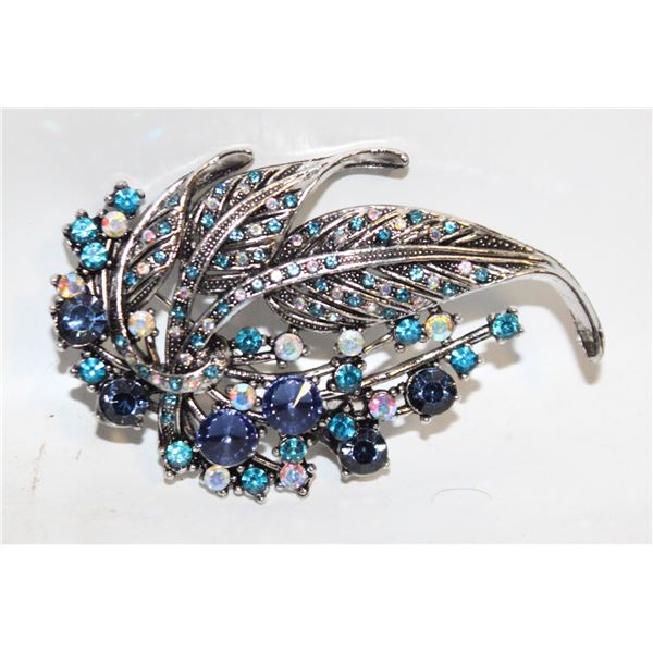 11)  SILVER TONE WITHSHADES OF BLUE AND