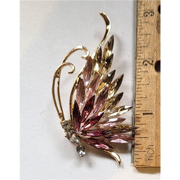 9)  GOLD TONE WITH CLEAR AND PALE PINK